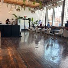 Tables and chairs at White Box Roastery where people sit to do their work and study